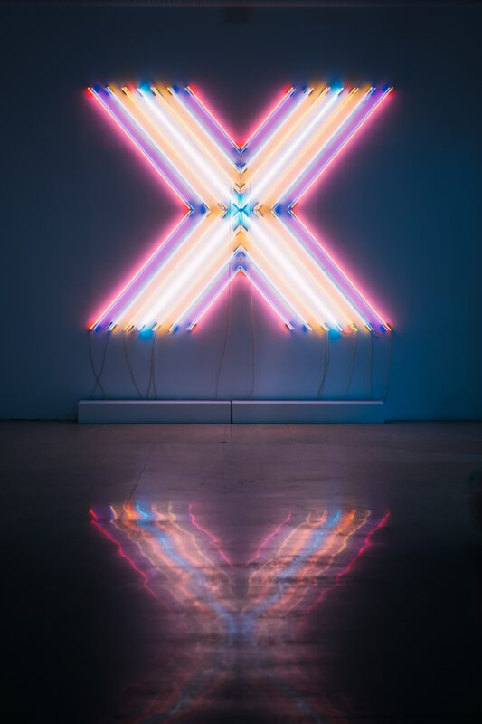 big neon sign with an x