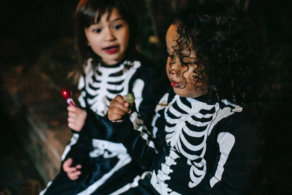 children eating candy on halloween
