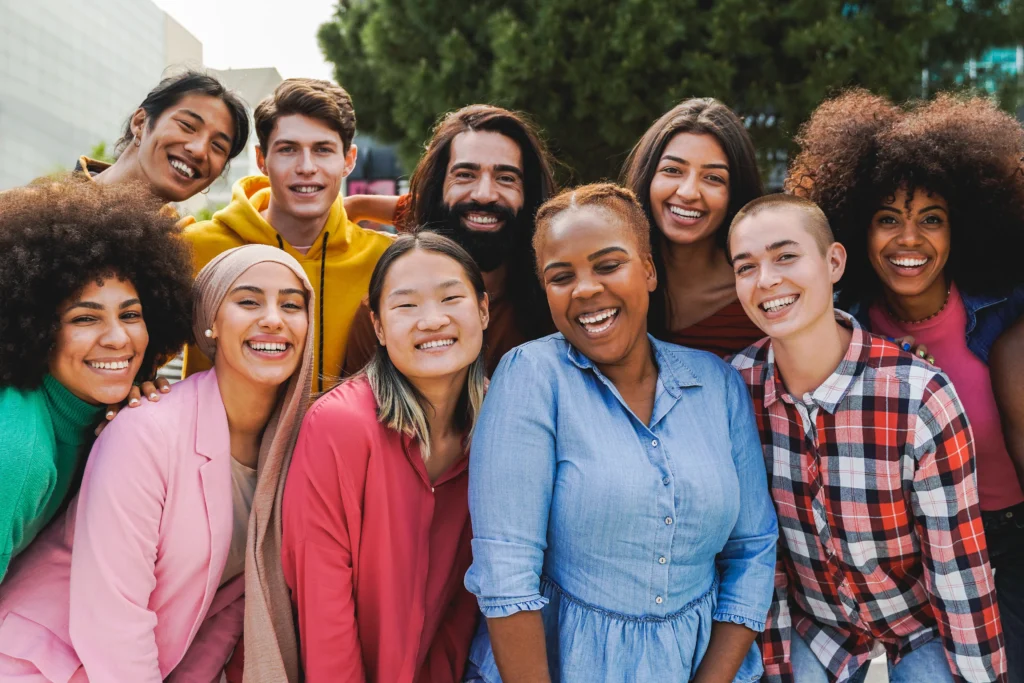 group of diverse people posing for a photo after group therapy